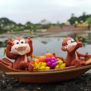 Monkey Rowing Boat doll