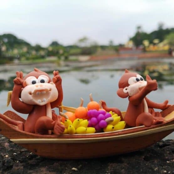 Monkey Rowing Boat doll
